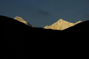 Tukuche peak and Dhaulagiri poke their heads into the sunrise. Jharkot, Nepal