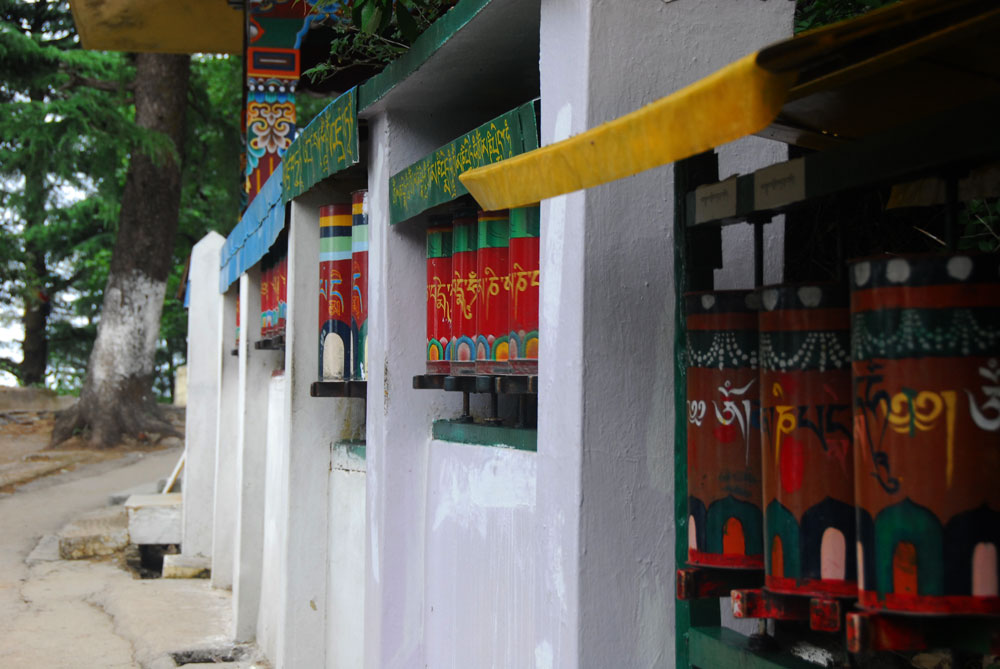 The prayer wheels rattle as they spin the prayers wishing all to be well