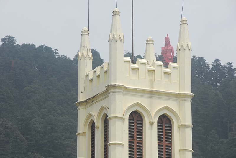 Hanuman sits high on the hill above the Church.