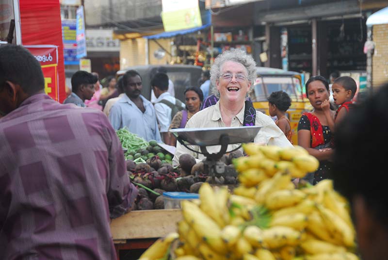 A happy Jacqui amid the bananas