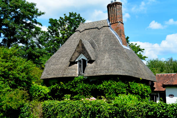 A thatched cottage ... not so old. Thatch is having a revival in the South of England.