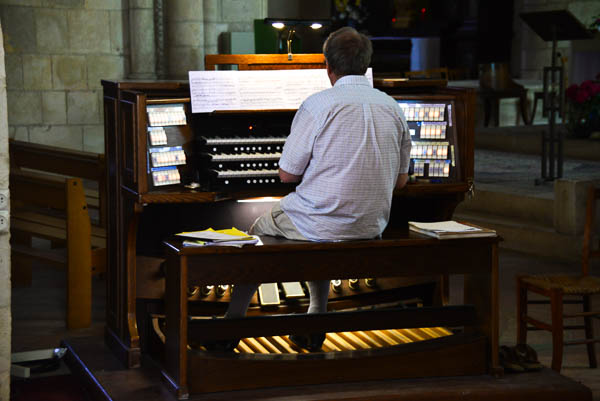 The practising organist fills the church with sound.