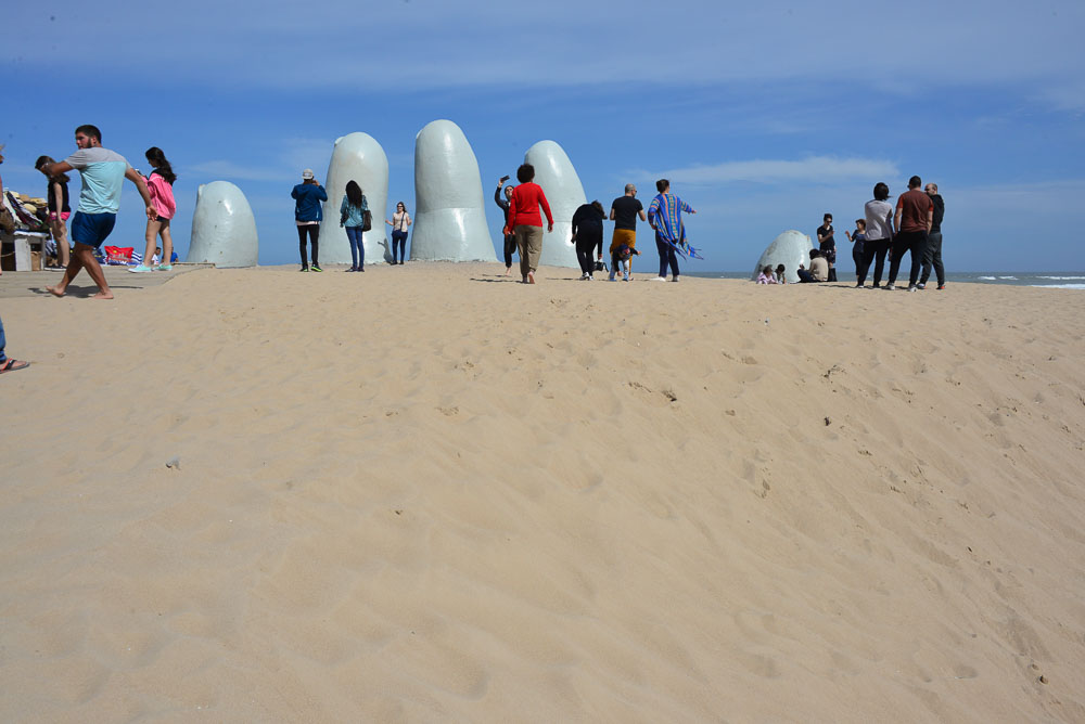 Buried hand sculpture in Punta del Este, Uruguay.