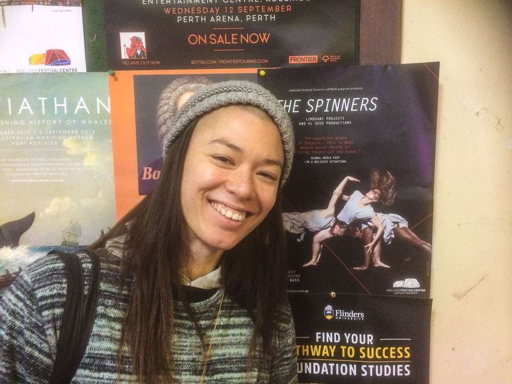 Image of Tara Samaya next to a poster for her forthcoming show called Spinners