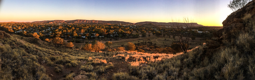 An image of Alice Springs in a fold of the MacDonnell Ranges.