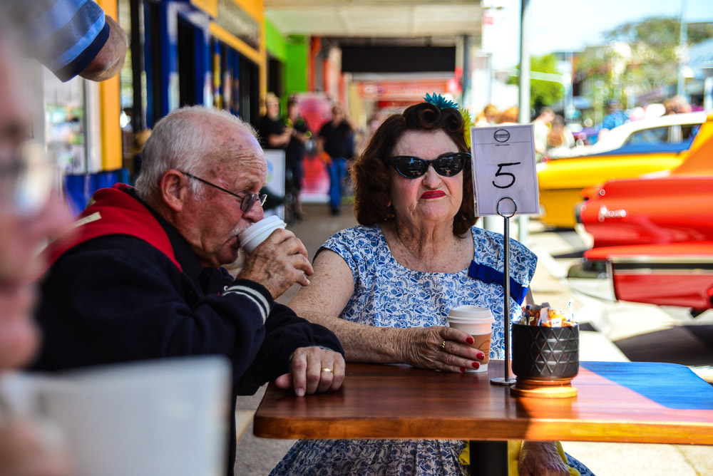 A couple drink coffee in a cafe in Maryborough Queensland