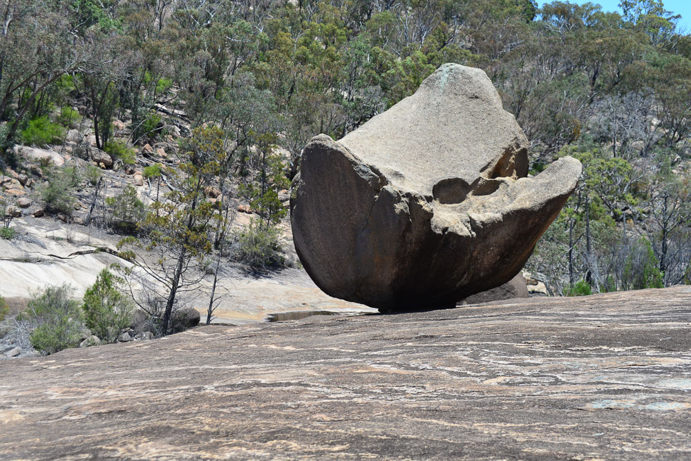 Rocks balance precariously on the granite slopes