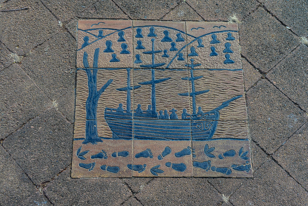 This pavement mosaic shows many sorts of feet watching the ship arrive.